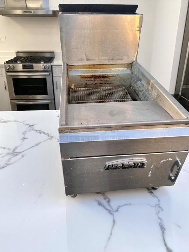 Stainless steel Imperial deep fryer with visible "OIL LEVEL" marking, used condition, commercial kitchen equipment.