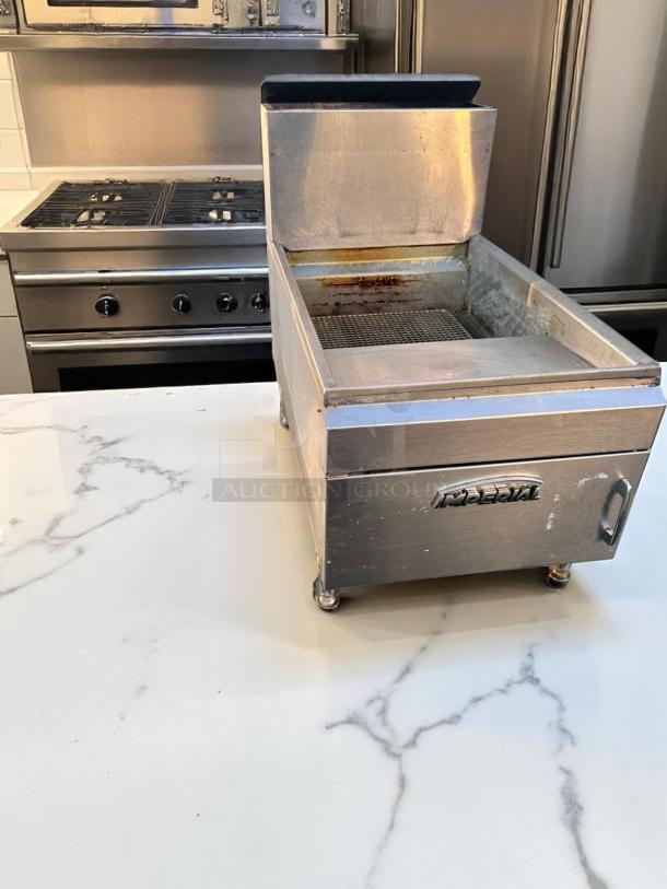 Stainless steel Imperial countertop fryer, used condition, visible oil level marking, sturdy build, adjustable feet.