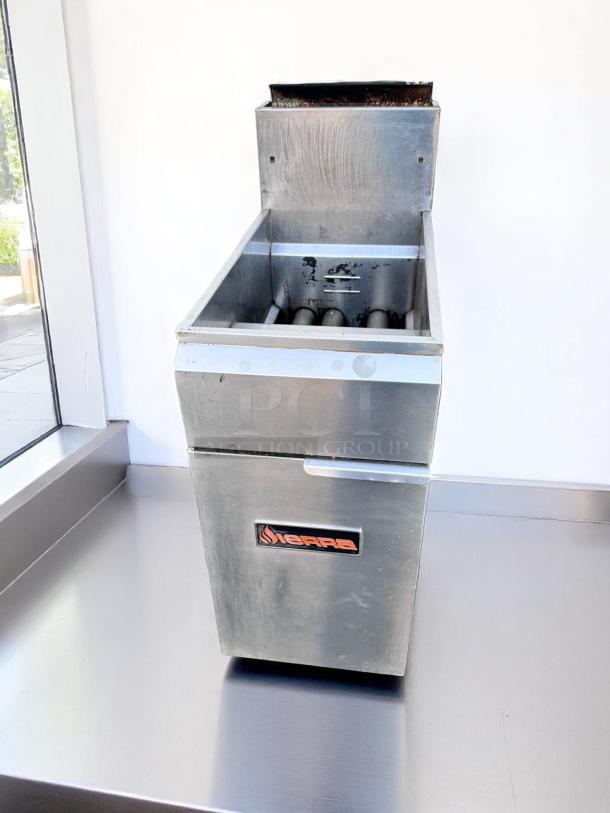 Sierra commercial deep fryer, stainless steel, visible wear, used condition, with branding label on the front.