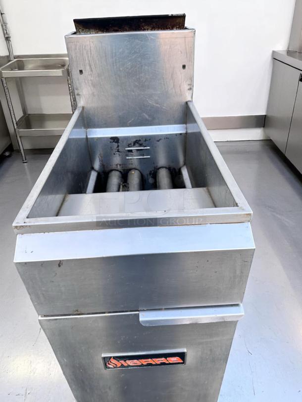 Commercial stainless steel fryer, Sierra brand; slight wear, visible in working condition. Suitable for restaurant use.