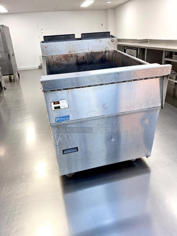 Pitco deep fryer in stainless steel with visible wear. Features power and heating controls. Ideal for commercial kitchens.