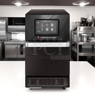 Merrychef commercial oven with touchscreen controls, black stainless steel, modern, excellent condition. Perfect for quick service restaurants.