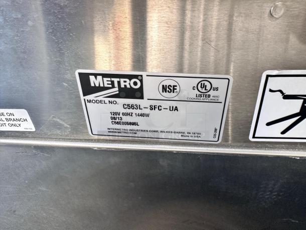 Metro cooking appliance label, model C563L-SFC-UA, 120V, 60HZ, 1440W, UL listed, NSF certified, made in USA.
