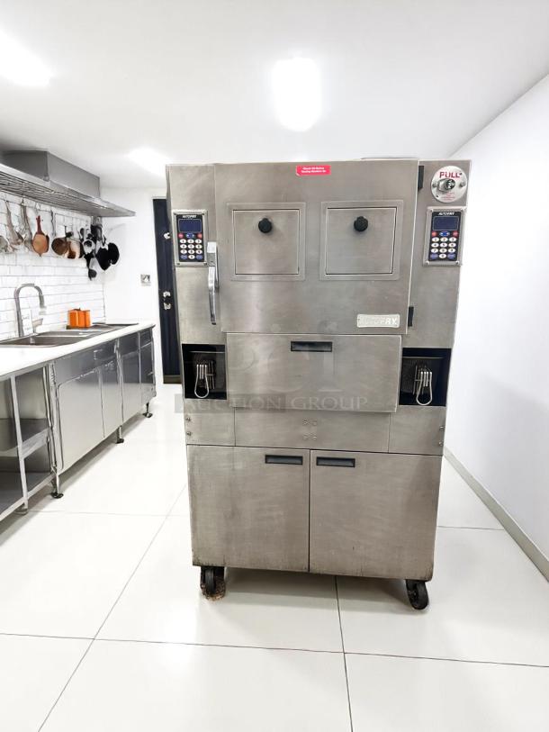 Commercial fryer with dual control panels and pull knobs, stainless steel, labeled "AutoFry," in good condition.