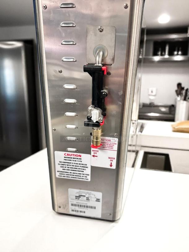 Stainless steel commercial water boiler with labeled control valve, caution stickers, excellent condition.