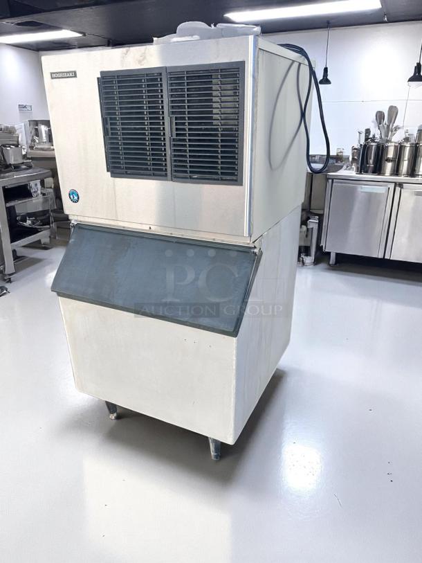 Hoshizaki commercial ice machine, stainless steel, top vent. Used condition, includes electrical cord, ideal for large kitchens.
