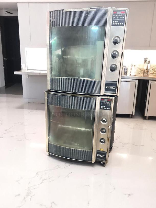 Double-stack Hobart convection ovens, stainless steel, commercial use, digital controls, some wear visible, ideal for kitchens.