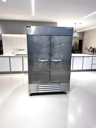 Silver Beverage-Air commercial refrigerator with double doors. Features include a top-mounted module, handles, and grille vent.