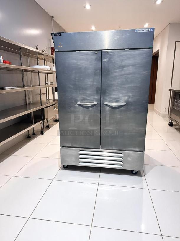 Beverage-Air commercial double-door refrigerator in stainless steel, model ER48-SS, with ventilation grille, good condition.