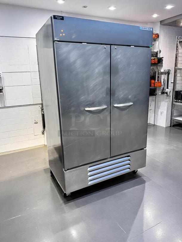 Commercial stainless steel two-door refrigerator by Beverage-Air, model Horizon. Well-maintained, ideal for kitchen use.