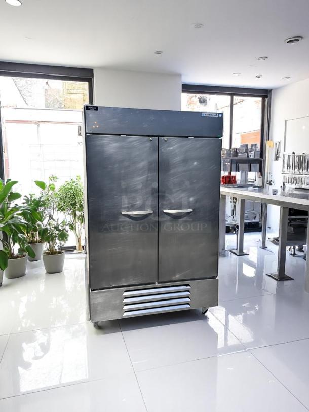 Commercial double-door stainless steel refrigerator, Beverage Air brand, in excellent condition, with vented bottom panel.