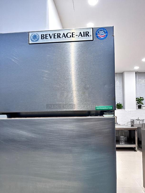 Stainless steel Beverage-Air refrigerator, top label reads "BEVERAGE-AIR," marked "Made in USA," with minor surface scratches.