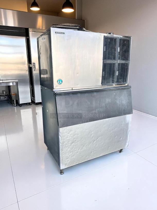 Hoshizaki ice maker in metallic finish. Features dual vents, minor surface blemishes. Label indicates brand authenticity.