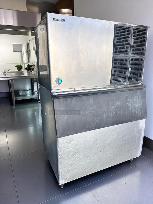 Hoshizaki commercial ice machine, stainless steel, used condition with slight dents. Logo and energy certification visible.
