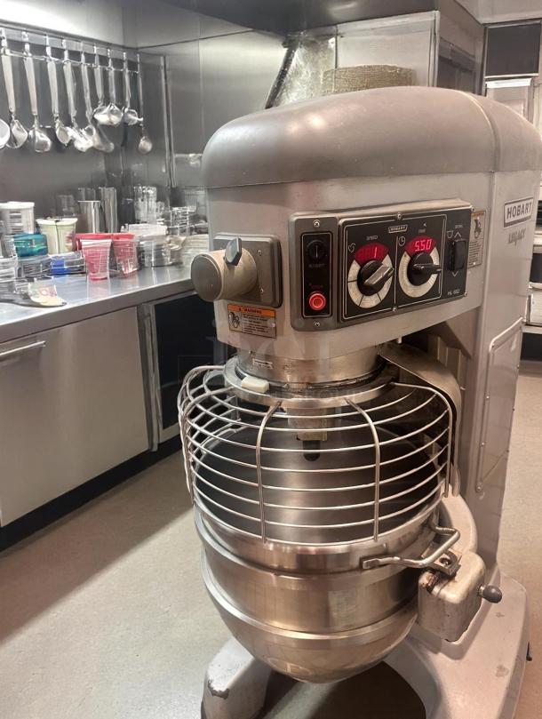 Hobart HL662 Legacy industrial mixer in a commercial kitchen, featuring control panel with speed and timer settings; well-maintained condition.