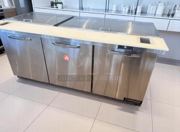 Stainless steel commercial refrigerator prep table, Continental brand, three-door, digital temperature display at 36°F, used condition.