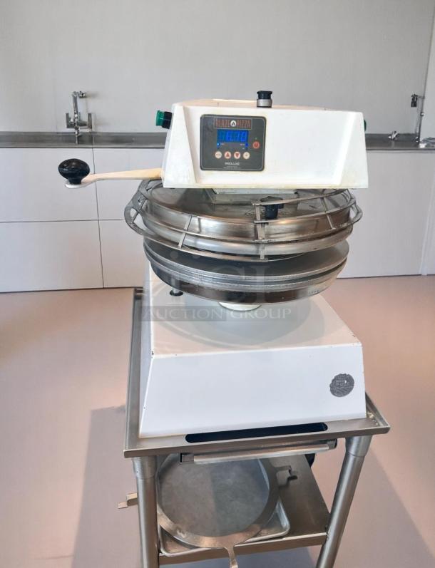 Pizza dough press machine with digital display, handle, and metal construction, branded "SLAZ PIZZA," in good condition.