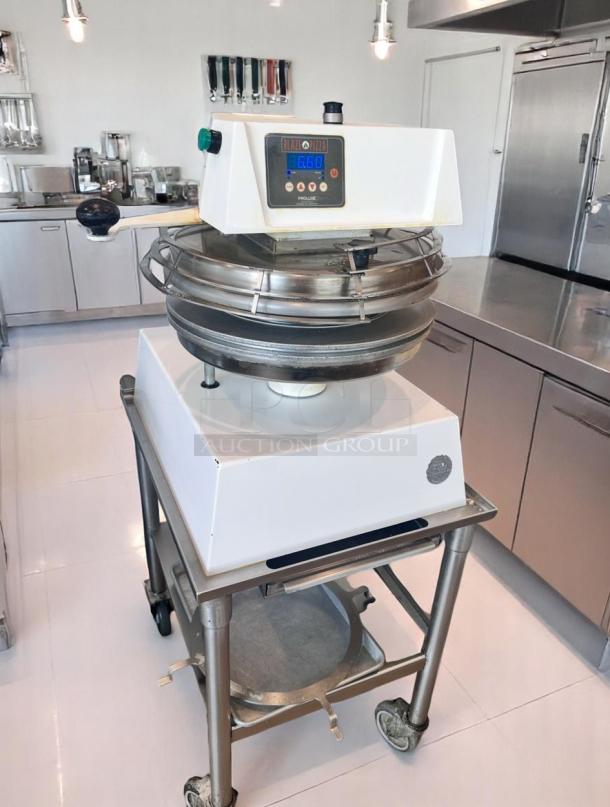 Commercial dough press with digital display, labeled "Blaze Pizza." Mounted on a rolling stand, in good condition.