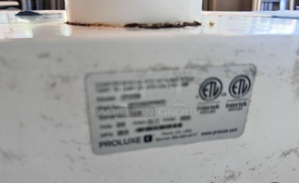 Industrial mixer with visible Proluxe label showing model 2000M indicating ETL certification; shows signs of use.