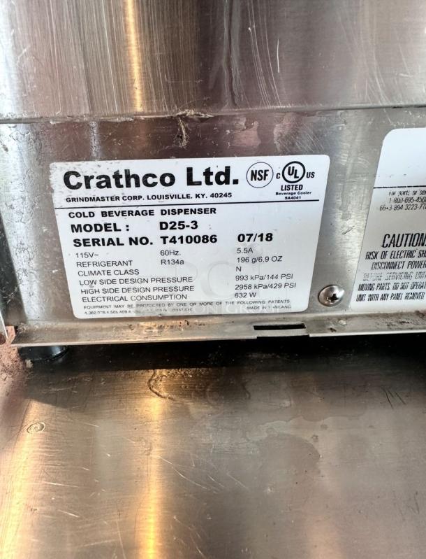 Crathco Ltd. cold beverage dispenser, model D25-3, serial T410086. Features NSF, UL ratings, uses R134a refrigerant.