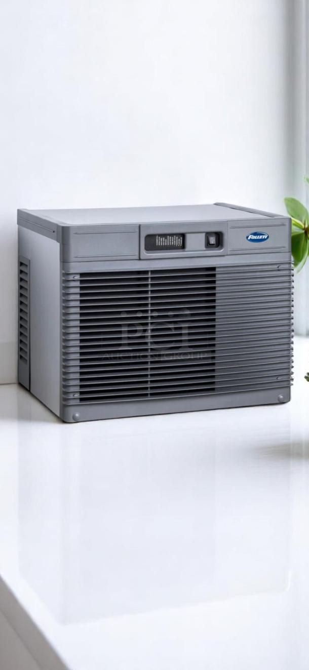 Follett countertop ice machine, gray, with ventilation grilles and power switch, excellent condition, model logo displayed.