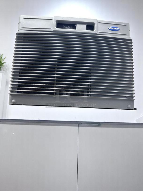 Follett air conditioning unit, silver with front grill, rectangular vents, appears in good condition, brand logo visible.