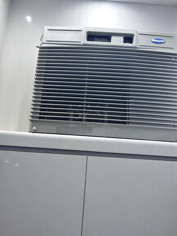 Follett window air conditioner, white, with vent grilles. Visible branding and control panel. Used condition.