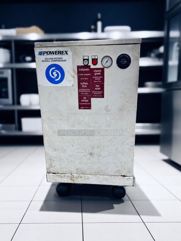 Powerex oilless rotary scroll compressor, used condition, white with visible wear. Features pressure gauge and menu stickers.