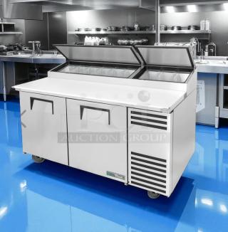 Commercial stainless steel sandwich prep table with dual doors and top refrigerated compartment, branded "True," in excellent condition.