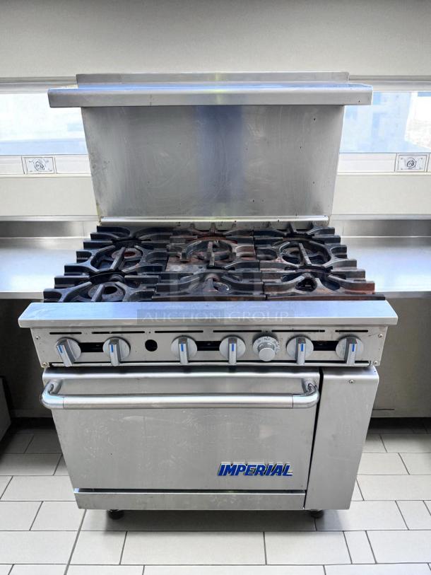 Imperial commercial gas stove with six burners and an oven, stainless steel, used condition, suitable for restaurant kitchens.