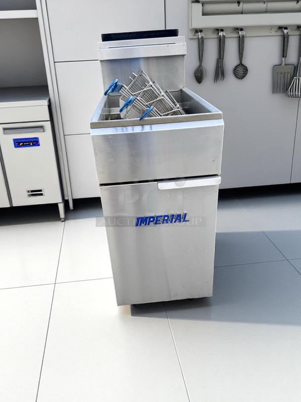 Imperial deep fryer in stainless steel, featuring dual baskets with blue handles. Brand logo visible. Excellent condition.