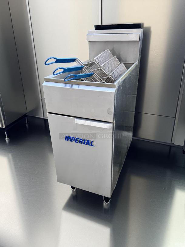 Imperial deep fryer with three baskets, stainless steel, used condition, "IMPERIAL" logo on front panel.