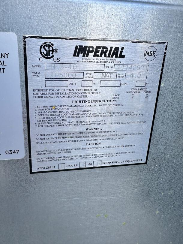 Label on Imperial commercial cooking equipment, model IS-40, 150,000 BTUs, natural gas, serial 1142522, with lighting instructions.