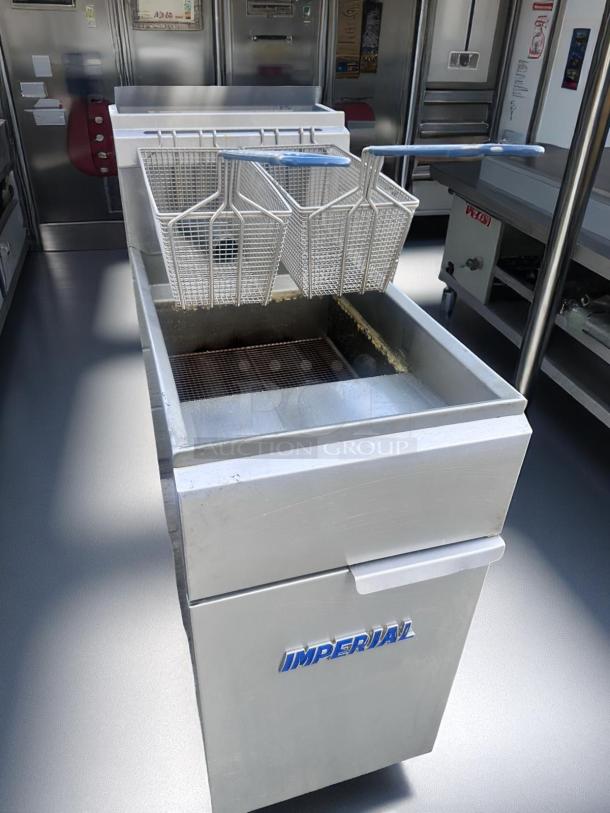 Commercial deep fryer, Imperial brand, with dual baskets, stainless steel, used condition. Perfect for high-capacity frying.