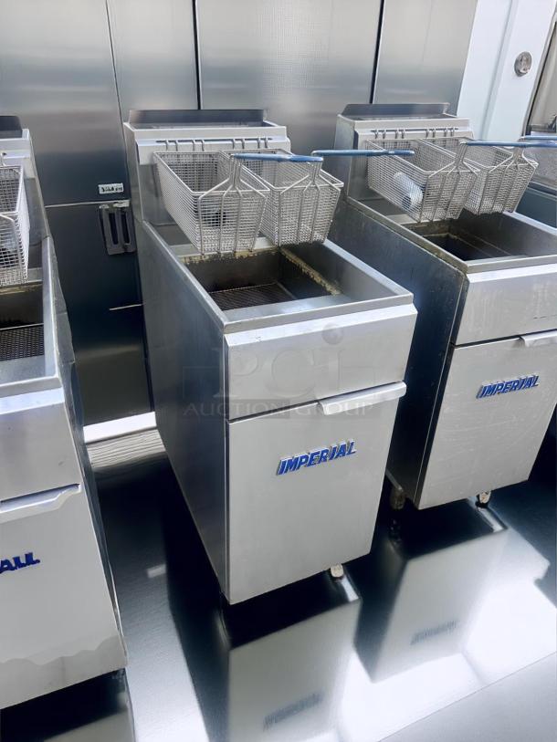 Commercial-grade Imperial deep fryer with dual baskets, stainless steel finish, used condition, visible branding.
