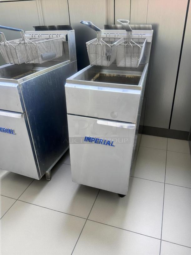 Stainless steel Imperial deep fryer with dual baskets, used condition, visible brand logo on front panel.