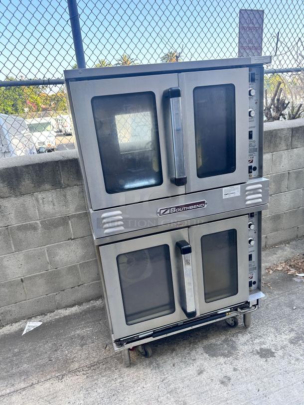 Southbend double-deck convection oven, stainless steel, used condition, with clear viewing windows and control knobs, on wheels.