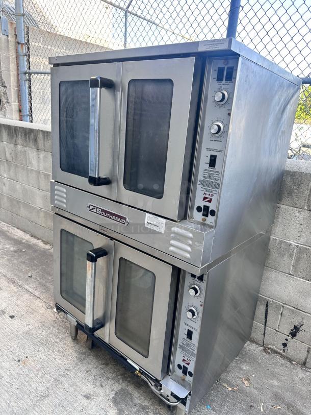 Two Southbend commercial convection ovens, stainless steel, double stack, glass doors, control panels, fair condition.