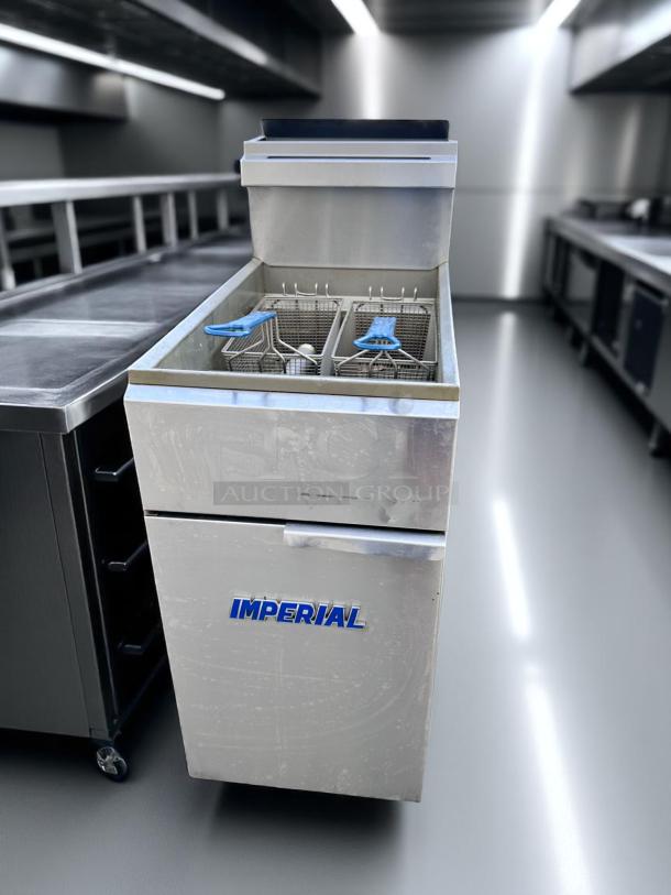 Imperial deep fryer, stainless steel, dual basket, commercial kitchen appliance, lightly worn, "IMPERIAL" logo visible.