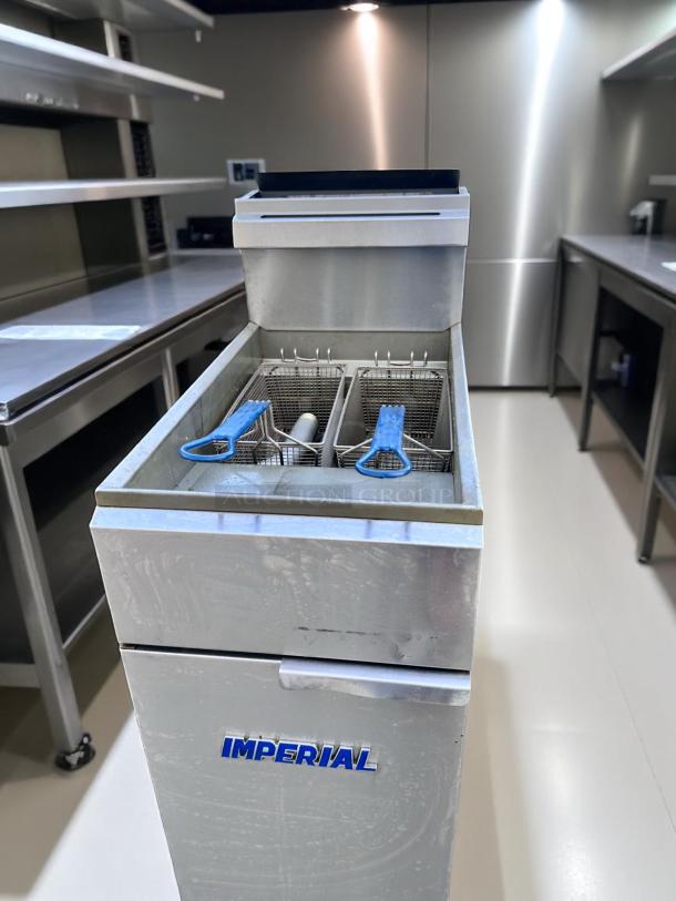 Commercial deep fryer by Imperial, stainless steel, dual basket, gently used, visible brand logo, ideal for kitchens.