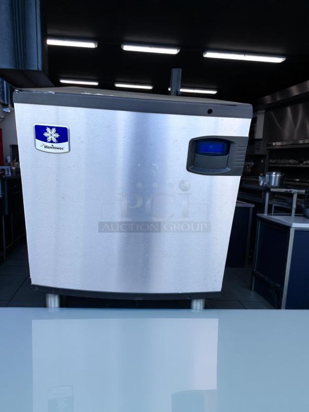 Manitowoc ice machine in stainless steel, good condition, commercial grade. Features digital control panel.