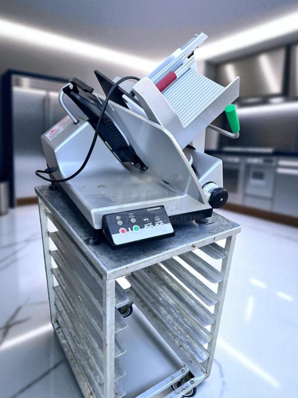 Commercial meat slicer on metal rack, Bizerba brand, in used condition. Features adjustable blade and safety guards.