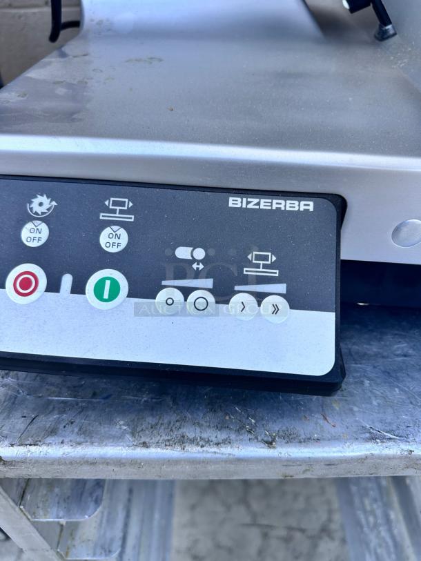 Bizerba slicer control panel with labeled buttons, indicating power and operation functions. Used condition.