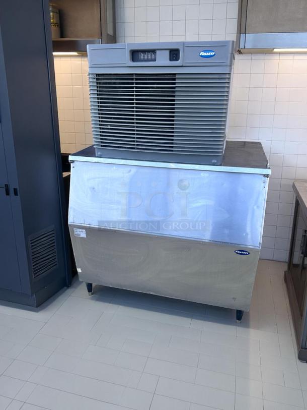 Scotsman ice maker on stainless steel bin, model tag visible, used condition, ideal for commercial kitchens.