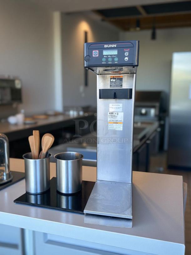 Bunn coffee brewer, stainless steel, digital controls, excellent condition, model number visible on label, commercial use.