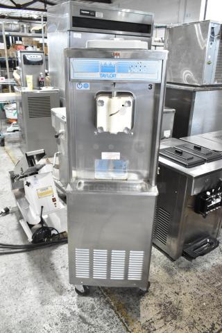 Taylor 441-27 Stainless Steel Commercial Water Cooled Floor Style Single Flavor Soft Serve Ice Cream Machine on Commercial Casters. Missing Front Piece. 208-230 Volts, 1 Phase. - Item #1191185