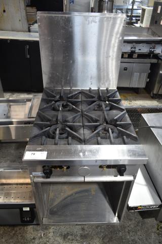 Garland X24-4S Stainless Steel Commercial Natural Gas Powered 4 Burner Range w/ Back Splash and Under Shelf.