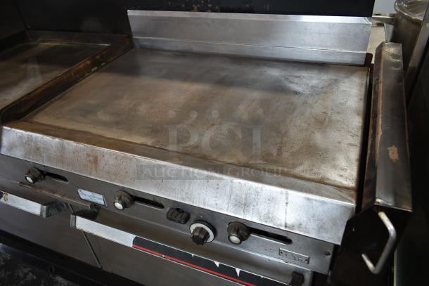 Vulcan Stainless Steel Commercial Gas Powered Flat Top Griddle w/ Right Side Flat Top Range, 2 Standard Oven, Over Shelf and Back Splash. - Image 2 of 11