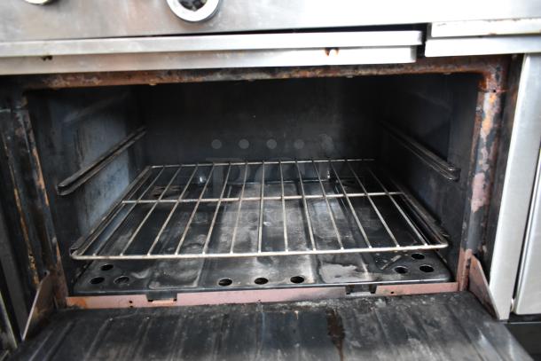 Vulcan Stainless Steel Commercial Gas Powered Flat Top Griddle w/ Right Side Flat Top Range, 2 Standard Oven, Over Shelf and Back Splash. - Image 8 of 11
