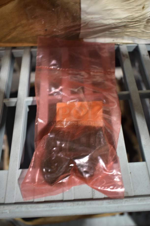 BRAND NEW SCRATCH AND DENT! Box of 100 Lancaster Table & Seating 427GLIDECHIR Glide for Aluminum Outdoor Chairs - Image 1 of 4
